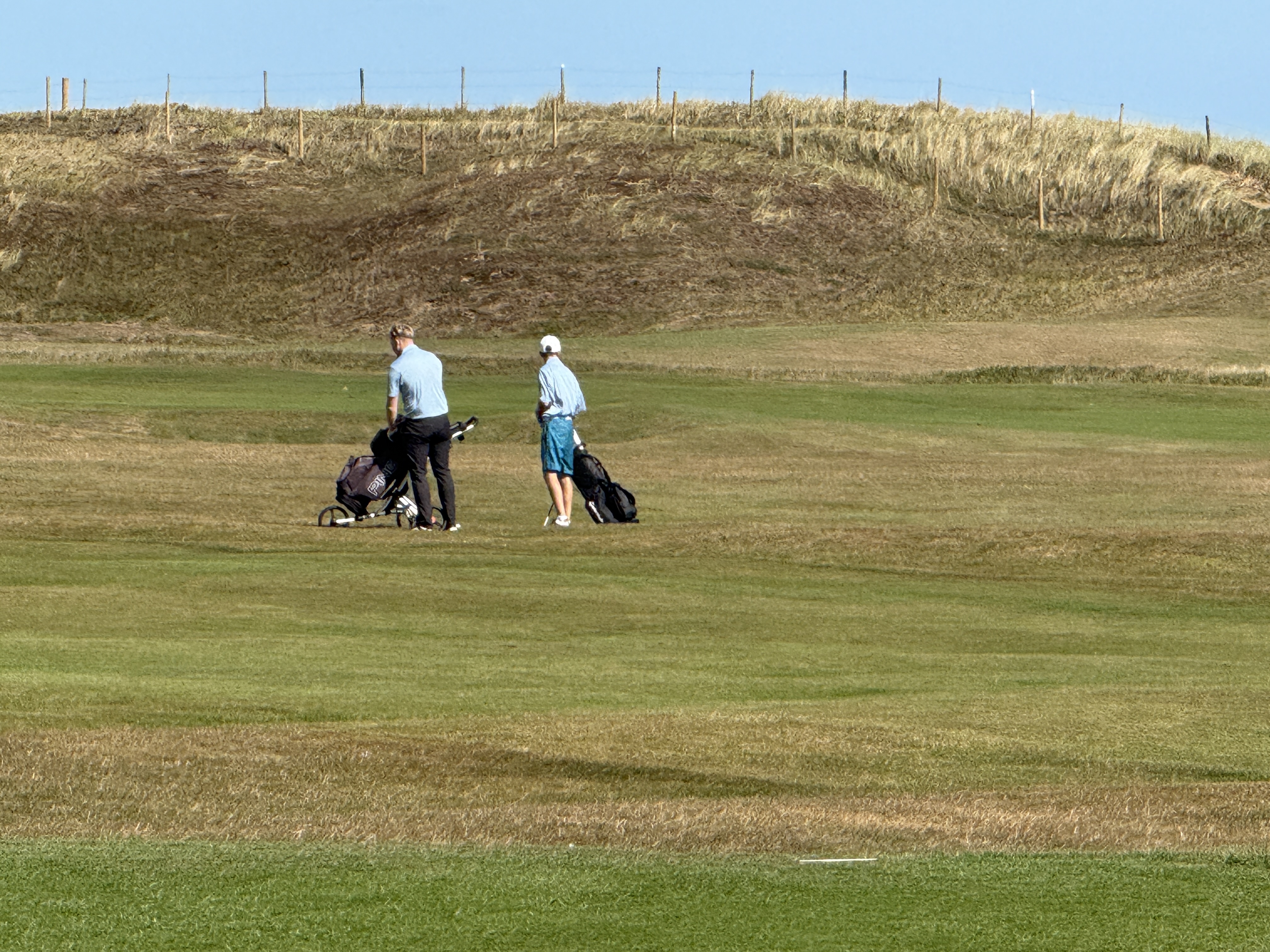 Two golfers walking the fairway at Hartlepool Golf Club