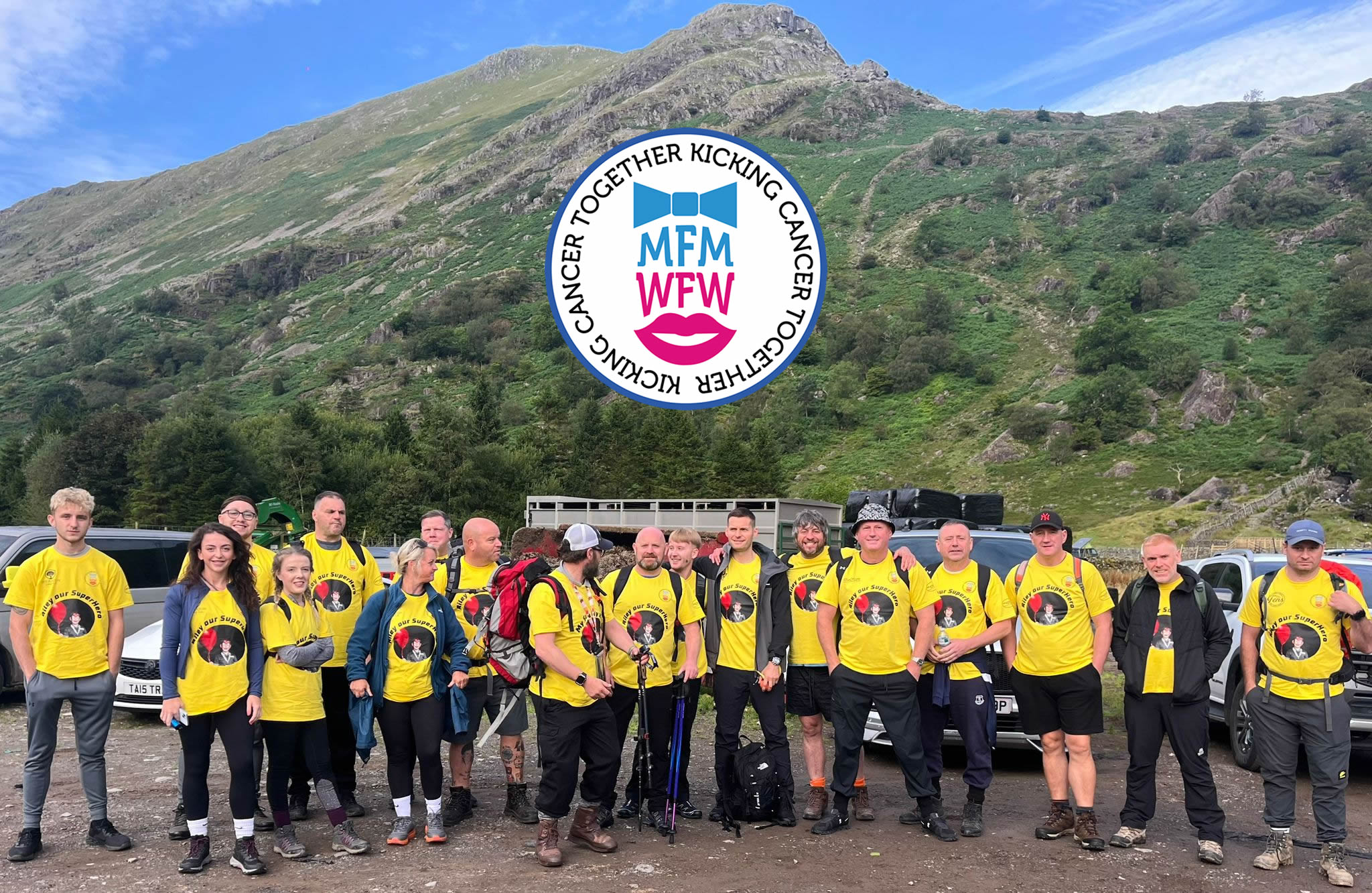 Miles For Men Ska Fell Hike team in yellow Riley t-shirts at the foot of the mountain